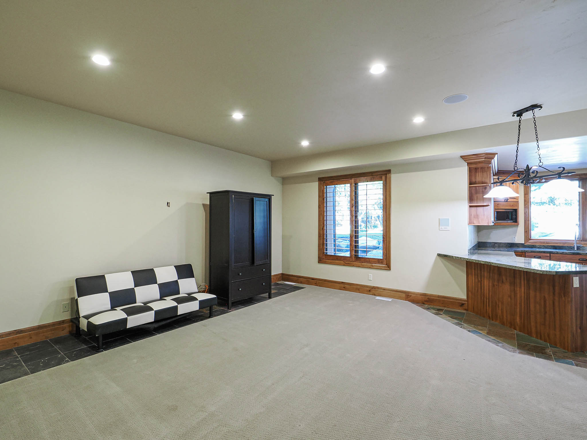 Bedroom featuring multiple windows, recessed lighting, and dark colored carpet