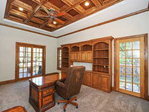 Office space featuring ornamental molding, coffered ceiling, light colored carpet, a ceiling fan, and recessed lighting