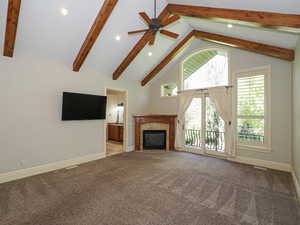 Unfurnished living room featuring recessed lighting, carpet flooring, a premium fireplace, and a ceiling fan