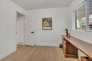 Office featuring light wood-type flooring and baseboards
