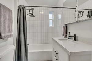 Full bathroom featuring vanity and shower / tub combo