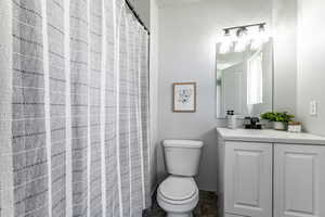 Bathroom featuring vanity and a shower with shower curtain
