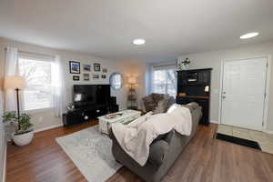 Living room featuring wood finished floors and baseboards