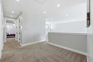 Unfurnished room featuring light carpet and recessed lighting