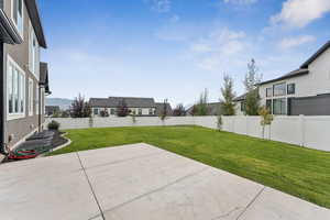 Fenced backyard featuring a patio area