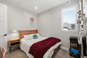 Bedroom with carpet floors and recessed lighting