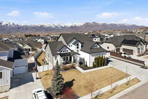 Aerial perspective of suburban area featuring a mountain backdrop