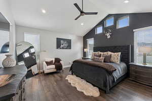 Bedroom featuring a high ceiling, dark wood-style floors, ceiling fan, and recessed lighting