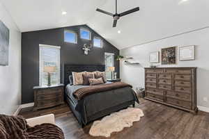 Bedroom featuring multiple windows, dark wood-style floors, a ceiling fan, a high ceiling, and recessed lighting