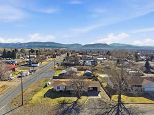 Aerial perspective of suburban area with a mountain backdrop