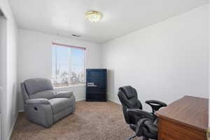 Office with carpet floors and baseboards