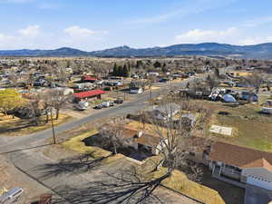 Aerial perspective of suburban area with a mountainous background