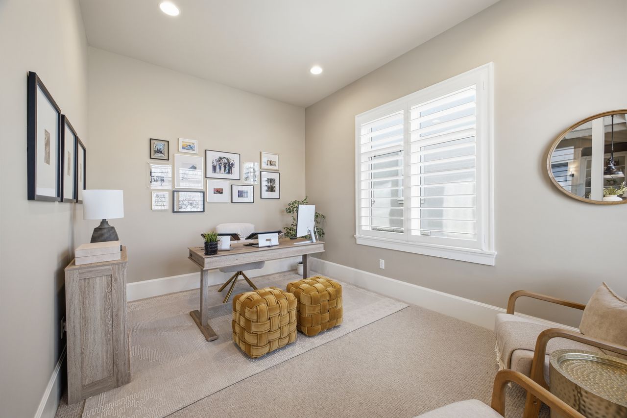 Carpeted office with baseboards and recessed lighting