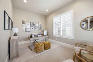 Carpeted office with baseboards and recessed lighting