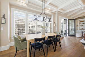 Dining area featuring beamed ceiling and hardwood / wood-style flooring