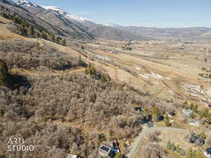 View of mountain backdrop with rural landscape