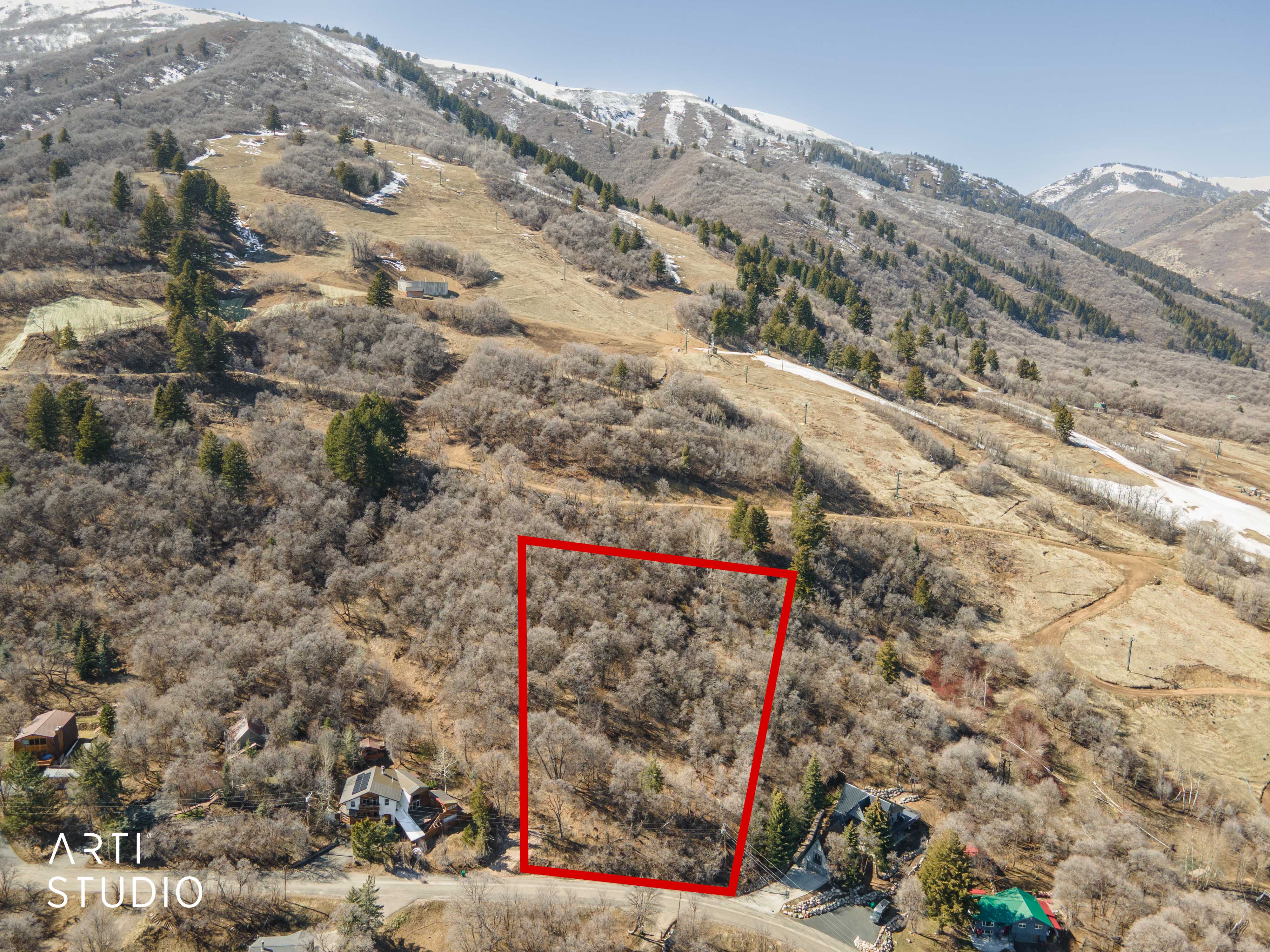 Aerial overview of property's location featuring property boundaries highlighted and mountains
