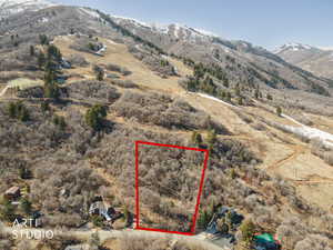 Aerial overview of property's location featuring property boundaries highlighted and mountains