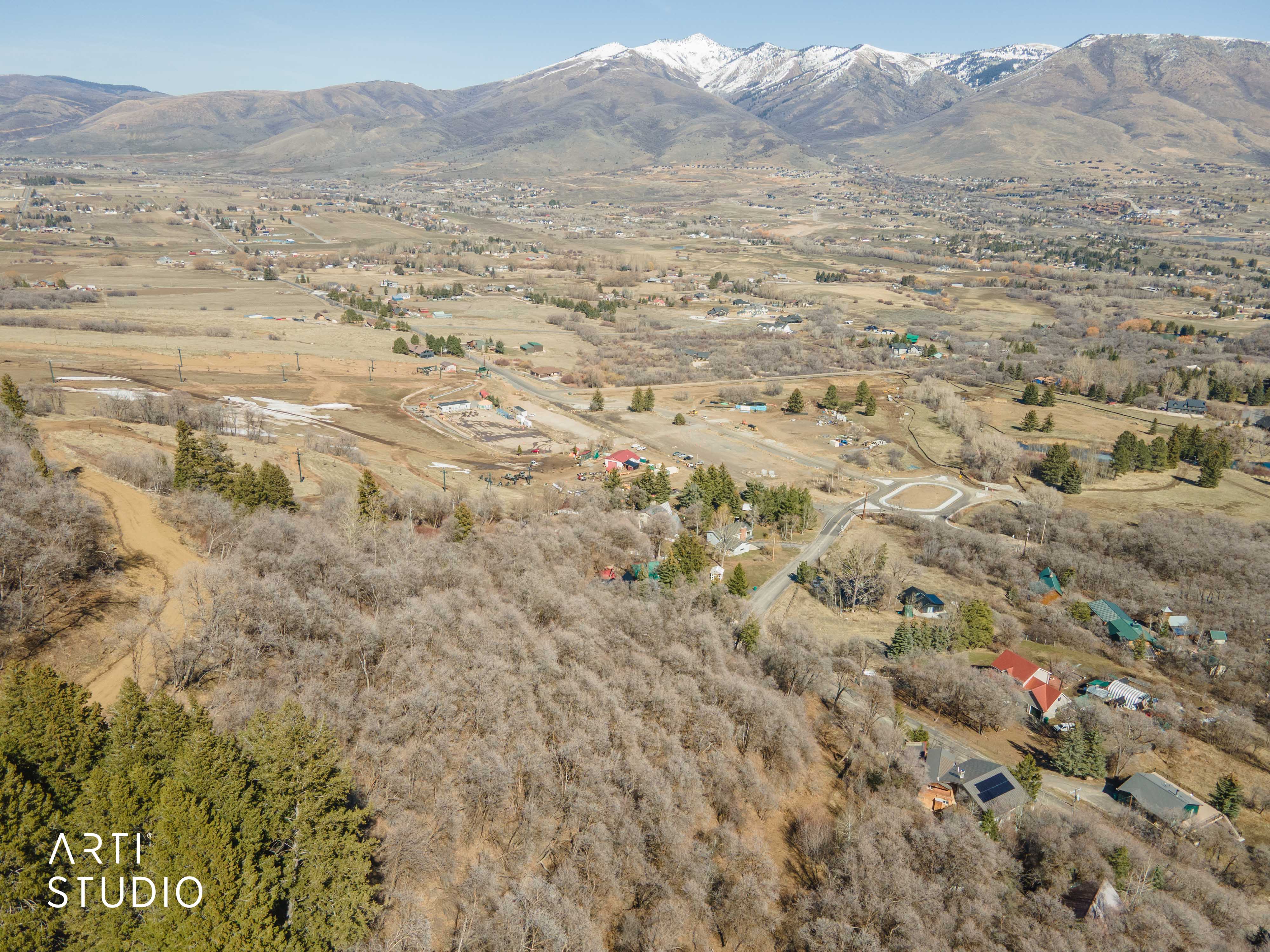 View of mountain backdrop featuring rural landscape