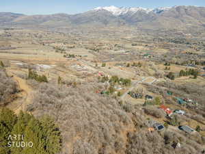 View of mountain backdrop featuring rural landscape