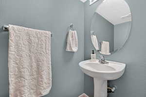 Bathroom with a textured wall