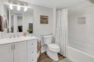 Full Bathroom featuring shower / bath combo, vanity, tile flooring.