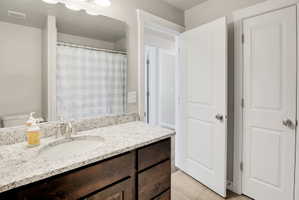 Full Bathroom with vanity, tub and a shower