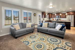 Living room with recessed lighting and light colored carpet