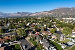 Aerial perspective of suburban area with a mountain backdrop