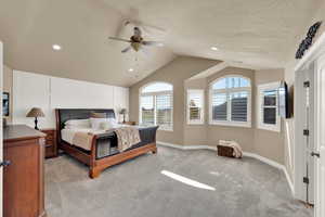 Bedroom featuring light carpet, ceiling fan, and recessed lighting