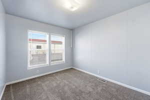 2nd Bedroom. Carpeted empty room with baseboards