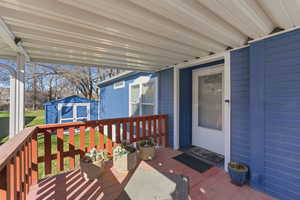 Deck with a yard and a storage shed