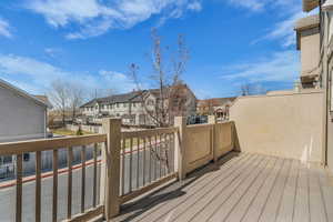 Wooden deck featuring a residential view