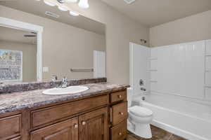 Master bathroom featuring vanity and bathing tub / shower combination
