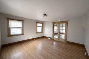 Master Bedroom featuring french doors and hardwood / wood-style flooring