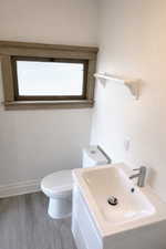 Bathroom with vanity and wood finished floors