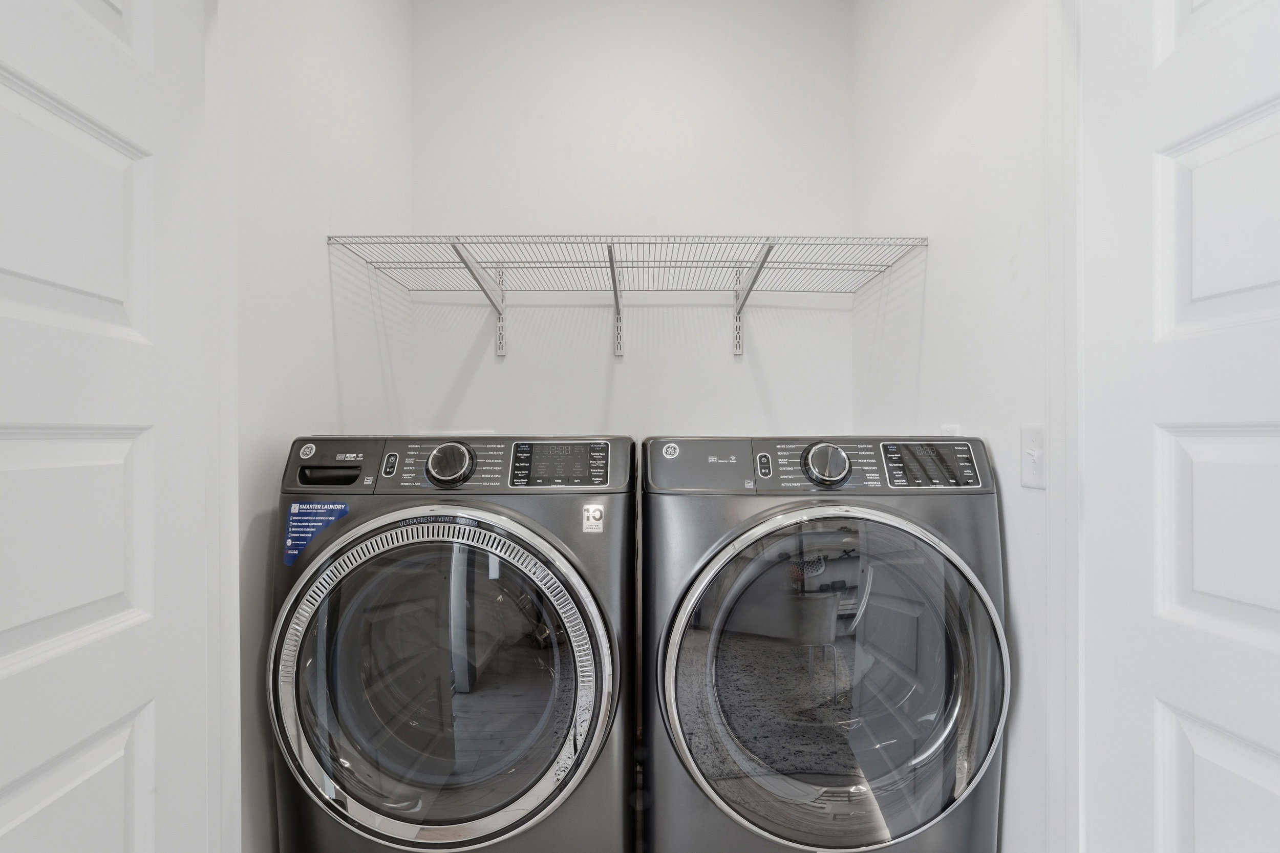 Laundry area with storage above