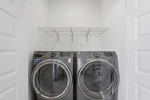 Laundry area with storage above