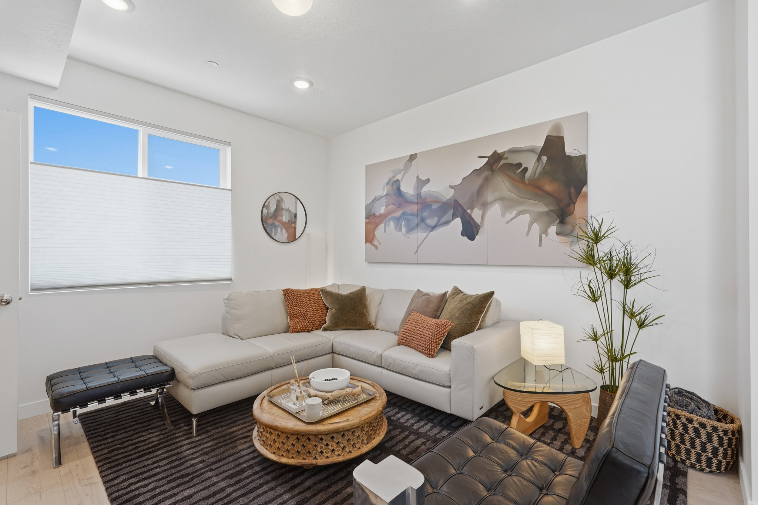 Open-concept main level features 9-foot ceilings and a spacious layout, ideal for entertaining or relaxing, centered around an oversized 8-foot kitchen island.