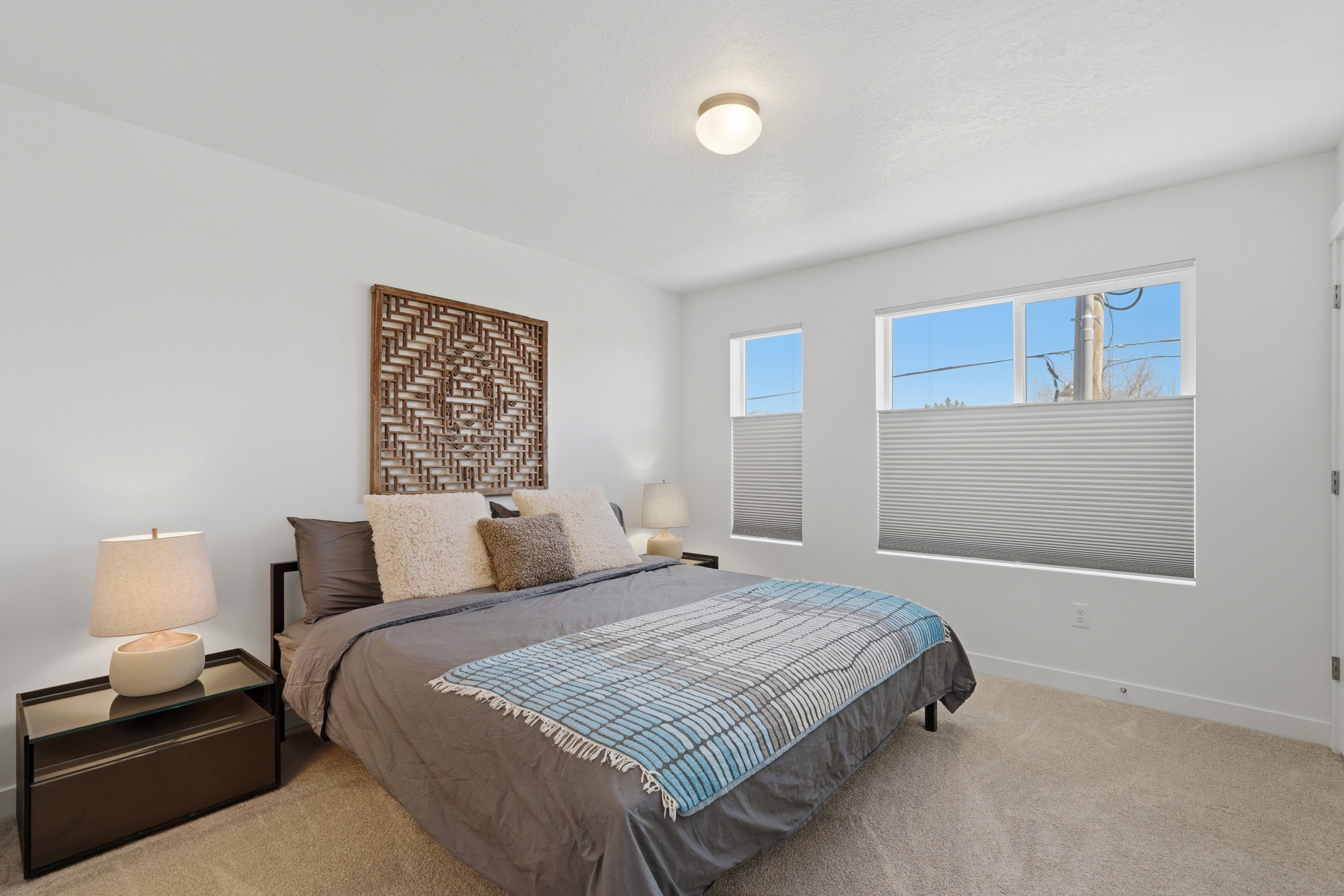 Large primary suite with east facing windows and mountain views