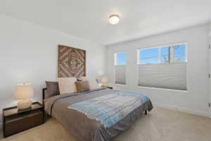 Large primary suite with east facing windows and mountain views