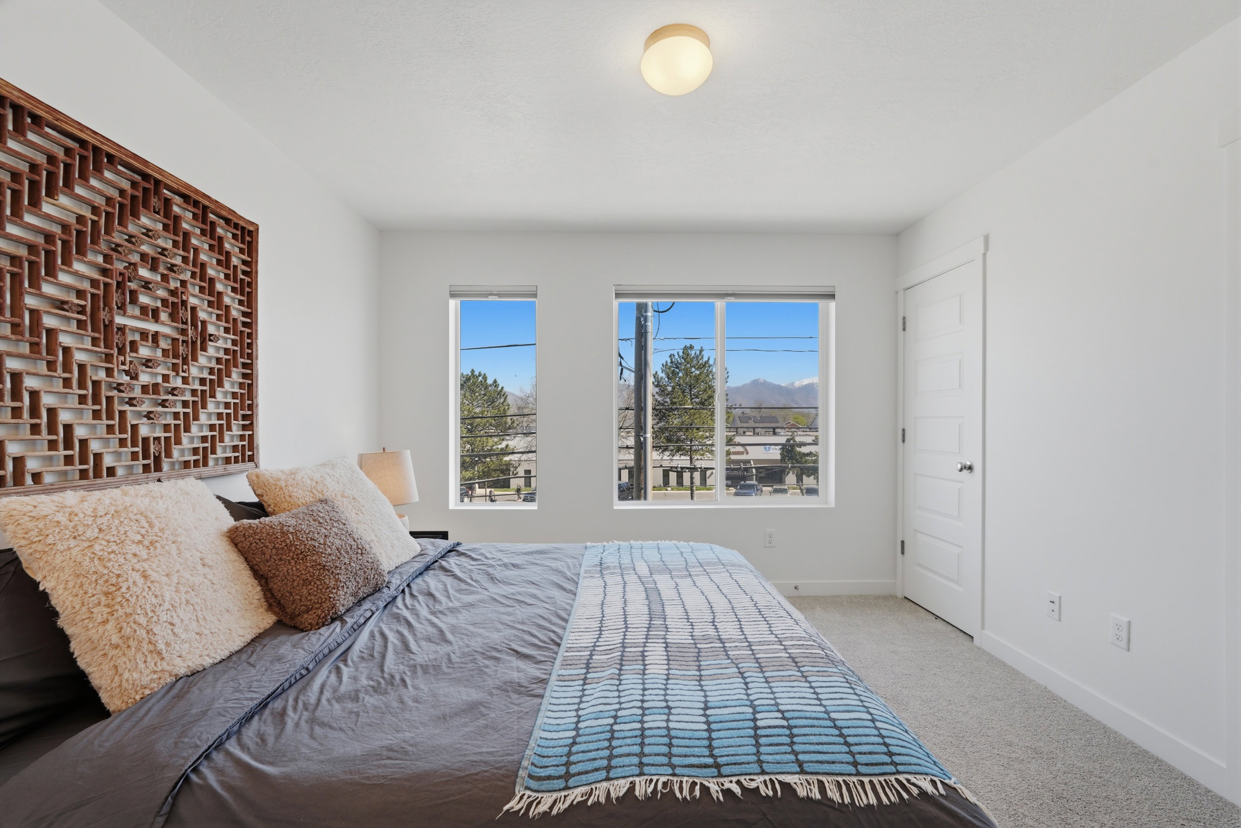 Large primary suite with east facing windows and mountain views
