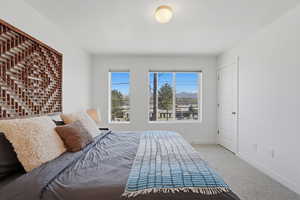 Large primary suite with east facing windows and mountain views