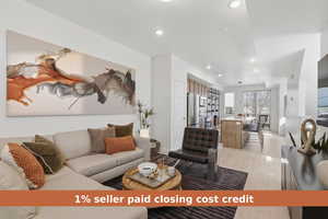 Living area with light wood-type flooring and recessed lighting
