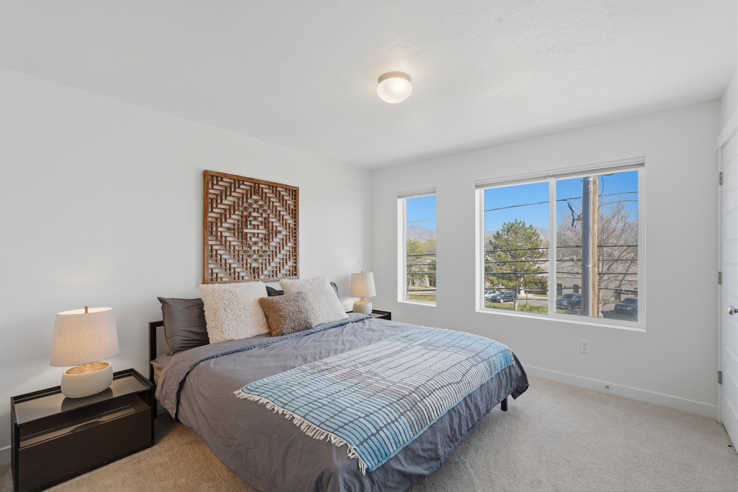 Large primary suite with east facing windows and mountain views