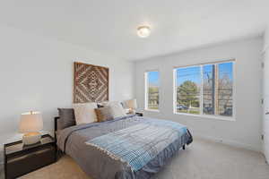 Large primary suite with east facing windows and mountain views