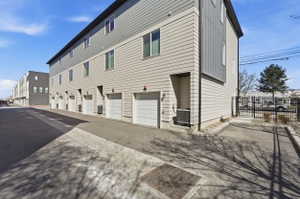 Back of house featuring a garage