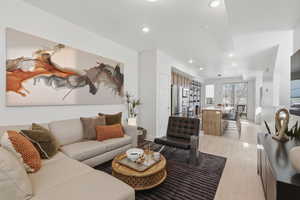 Open-concept main level features 9-foot ceilings and a spacious layout, ideal for entertaining or relaxing, centered around an oversized 8-foot kitchen island.