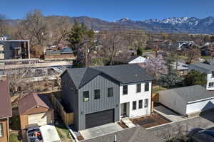 Aerial view of residential area featuring mountains