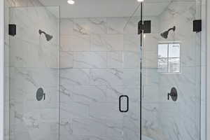 Full bathroom featuring a marble finish shower